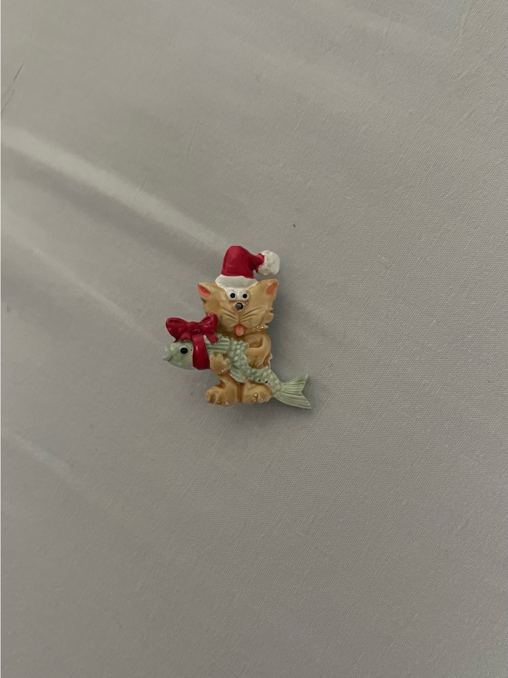 Christmas cat brooch with Santa hat and fish